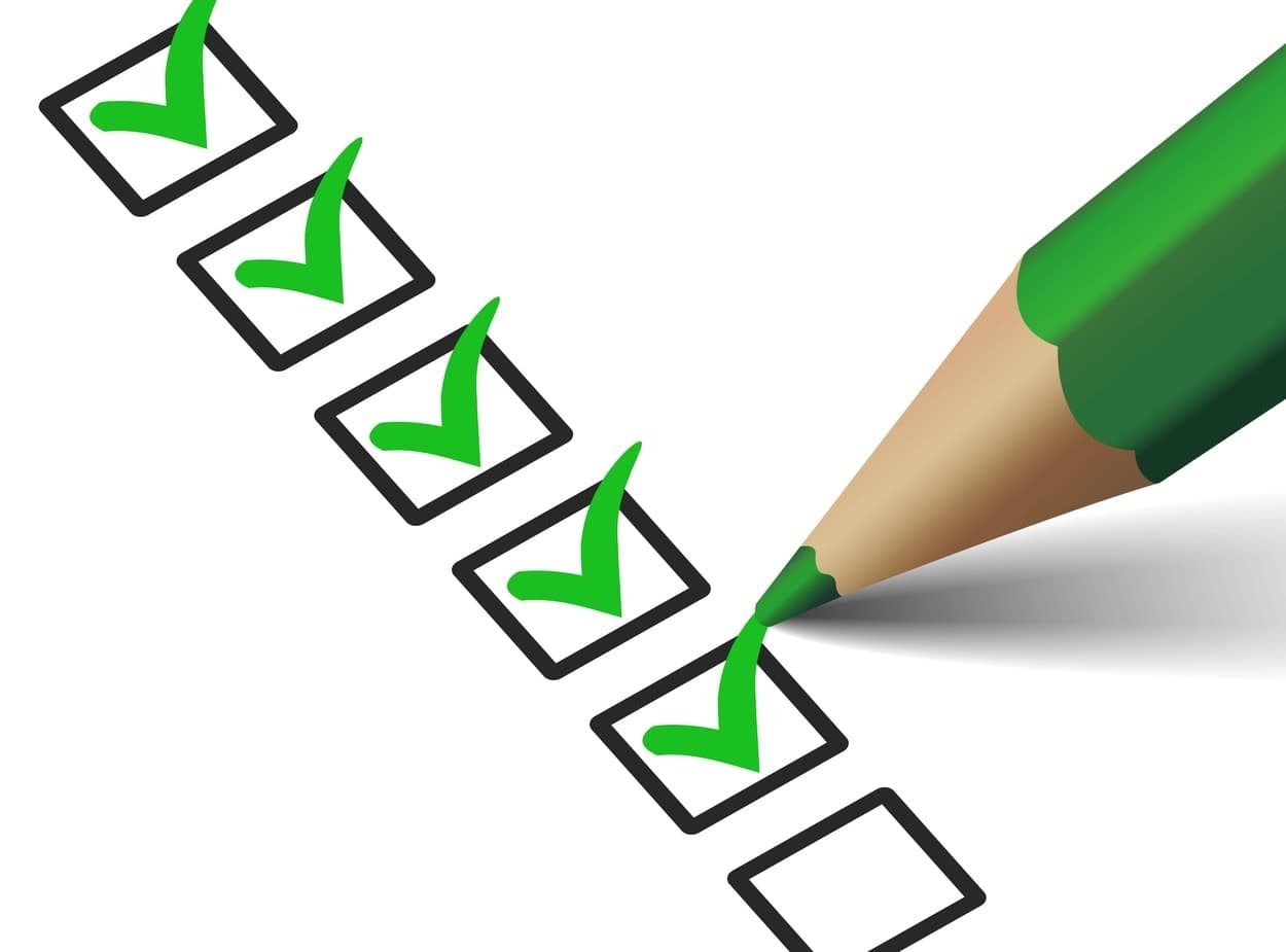 A person correctly ticking a checklist